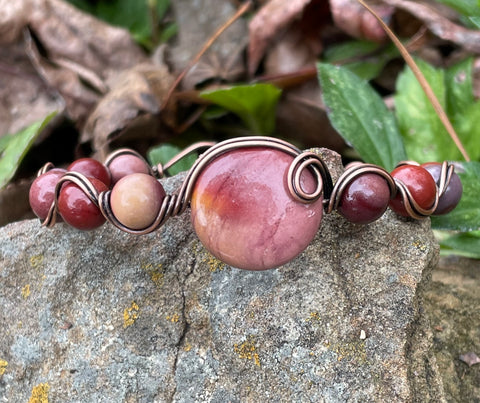 Mookaite Bracelet in Copper with vibrant blood red tones, pinks, and pale purples. 