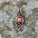 Delightful Mini Goldstone Pendant in Wire wrapped Copper with Copper Bead Accents. 