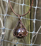 Bronzite sphere necklace captured in Copper that has been oxidized, polished and sealed.