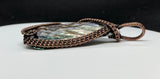 Self collected Iridescent Pen Shell Pendant wrapped in handwoven Copper. 