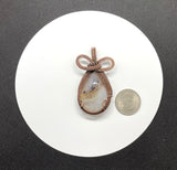 Large Montana Agate Pendant in wire wrapped Copper, with a bow on top. 