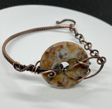 Adjustable Wire Wrapped Copper Bracelet with a Crazy Lace Agate Donut Centerpiece.  