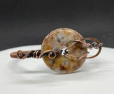 Adjustable Wire Wrapped Copper Bracelet with a Crazy Lace Agate Donut Centerpiece.  
