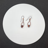 Wire wrapped Copper Earrings with Red Tiger Eye and Niobium Ear Wires. 