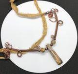 Embrace the elegance of nature and artistry with the Stunning Woven Copper Necklace. Featuring a striking combination of Picasso Jasper, copper beads, and a silk ribbon cord, this necklace is a unique statement piece that beautifully blends organic beauty with sophisticated design.