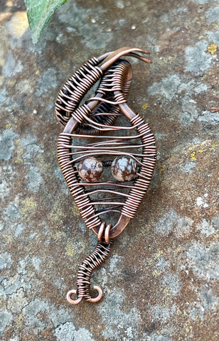Wire Wrapped Copper Snake Pendant with Snowflake Jasper Eyes. 