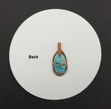 Add a stunning pop of color to your wardrobe with this beautiful turquoise blue Chrysocolla Cabochon wrapped in handwoven copper. 