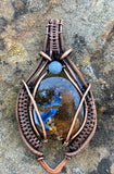 Beautiful Boulder Opal Pendant in wire wrapped copper with an Aquamarine accent. 