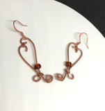 Hammered Copper Heart Earrings with Glass Bead Accent.