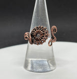 Wire Wrapped Copper Ring with a Czech Glass Circle inside. Adjustable from size 7-9. 