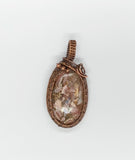 Mohave Rhodochrosite wrapped in Copper