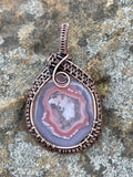 Lovely Pink Agate Pendant with a fluffy white center in Wire Wrapped Copper. 