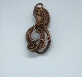 Handmade woven copper pendant with Tourmalinated Quartz quartz bead.