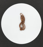 Handmade woven copper pendant with Tourmalinated Quartz quartz bead.