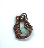 Intricately Woven Copper and Amazonite Pendant.