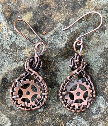 These Hand Woven Copper and Copper Gears Earrings are a striking and industrial-chic accessory that combines the craftsmanship of handwoven copper wire with the bold aesthetic of copper gears. These earrings are a standout for their unique combination of rustic materials and mechanical-inspired design, all elegantly finished with handmade copper ear wires.
