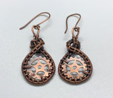 These Hand Woven Copper and Copper Gears Earrings are a striking and industrial-chic accessory that combines the craftsmanship of handwoven copper wire with the bold aesthetic of copper gears. These earrings are a standout for their unique combination of rustic materials and mechanical-inspired design, all elegantly finished with handmade copper ear wires.
