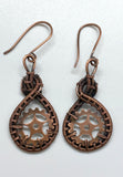 These Hand Woven Copper and Copper Gears Earrings are a striking and industrial-chic accessory that combines the craftsmanship of handwoven copper wire with the bold aesthetic of copper gears. These earrings are a standout for their unique combination of rustic materials and mechanical-inspired design, all elegantly finished with handmade copper ear wires.
