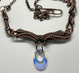 Wire Wrapped Copper Necklace with layers of Copper weaves on multiple components with an iridescent Swarovski Crystal Dangle. 