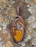 Colorful Agate Pendant with a Druzy Pocket wrapped in handwoven Copper. A unique piece with sparkle!