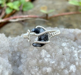 Adjustable (size 7+) Wire Wrapped Argentium Silver Ring with a Snowflake Obsidian Moon.