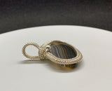 Lovely Striped Agate Pendant wrapped in handwoven Sterling (.925) and Fine (.999) Silver