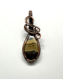 Wire Wrapped Copper and Schalenblende Stone Pendant. 