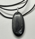 Polished River Rock Necklace with an engraved heart and an aluminum bail on a adjustable black leather cord