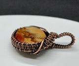 Beautiful Colored Banded Calcite Pendant wrapped in Copper
