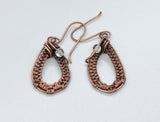 Handwoven Copper Earrings with Iridescent Glass Bead Accents.