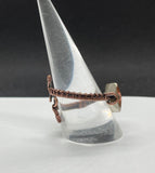 Adjustable Copper Wire Wrapped Ring with a brilliant peach colored Swarovski Crystal.