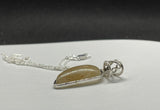 Golden Rutilated Quartz in Sterling Silver with 20" Sterling Silver Chain. 