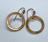 Colorful flame painted copper earrings on handmade copper ear wires.