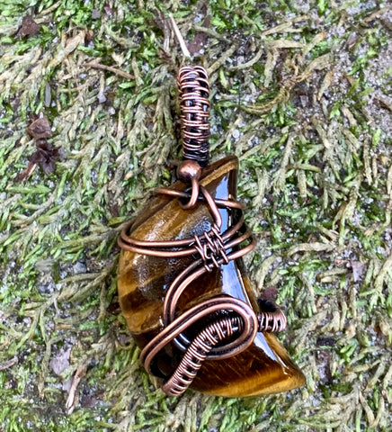 Lovely Striped Golden Tiger Eye Moon Cabochon wrapped in handwoven Copper and then given a patina to match the colors in the stone.