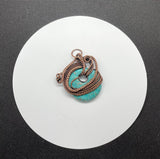 Turquoise Blue Howlite (dyed) Donut Pendant with layers of Copper Weaves and Coils.  