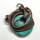 Turquoise Blue Howlite (dyed) Donut Pendant with layers of Copper Weaves and Coils.  