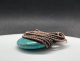 Turquoise Blue Howlite (dyed) Donut Pendant with layers of Copper Weaves and Coils.  