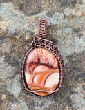 Beautiful swirling patterns in this Wave Hill Dolomite Pendant, wrapped in hand wrapped and woven copper.