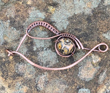 This handmade hammered and wire wrapped copper pin with Leopard Skin Jasper is the perfect addition to your outfit.