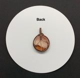 Beautiful colors of the sunset in this round Polychrome Jasper Pendant wrapped in copper.