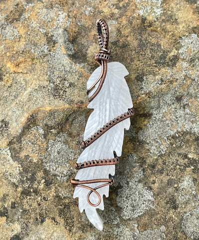 Beautiful striped Calcite Carved Feather Pendant wrapped in hand woven Copper. 