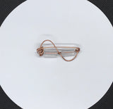 Swirled hammered copper and glass bead pin