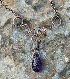 Carved Amethyst Necklace in wire wrapped Copper with Curled Heavy Gauge Copper. 