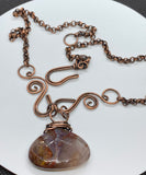 Hand formed Copper Swirls and a Beautiful Faceted Pietersite Stone in this stunning handmade necklace. 