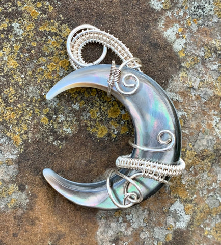 Wire wrapped in Sterling and Fine Silver, this Black Lip Shell Moon Pendant has eye catching shine!
