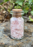 Glass Jar Filled with Tumbled Rose Quartz Chips.  