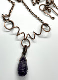 Carved Amethyst Necklace in wire wrapped Copper with Curled Heavy Gauge Copper. 