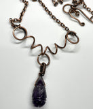 Carved Amethyst Necklace in wire wrapped Copper with Curled Heavy Gauge Copper. 