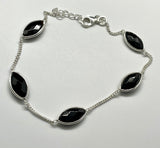 Delicate Adjustable Bracelet in Sterling Silver with Black Onyx Faceted Marquise Gemstones. 