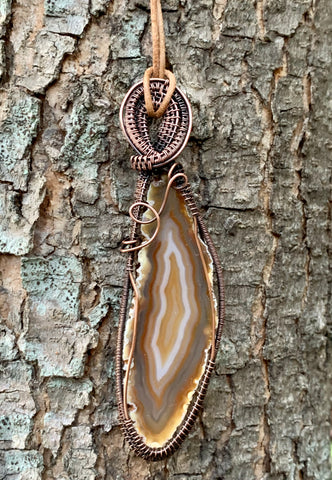 Make a bold statement with this colorful wire wrapped agate slice necklace.